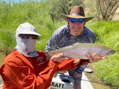 Our Blue Sky client catches another spectacular rainbow trout on our famous NM river.