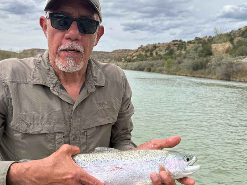 Angler with nice rainbow trout