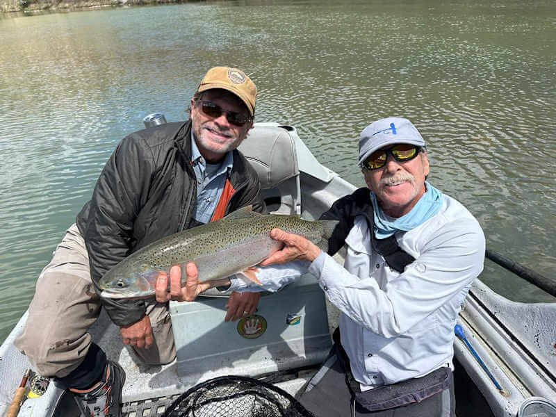 Angler with nice rainbow trout