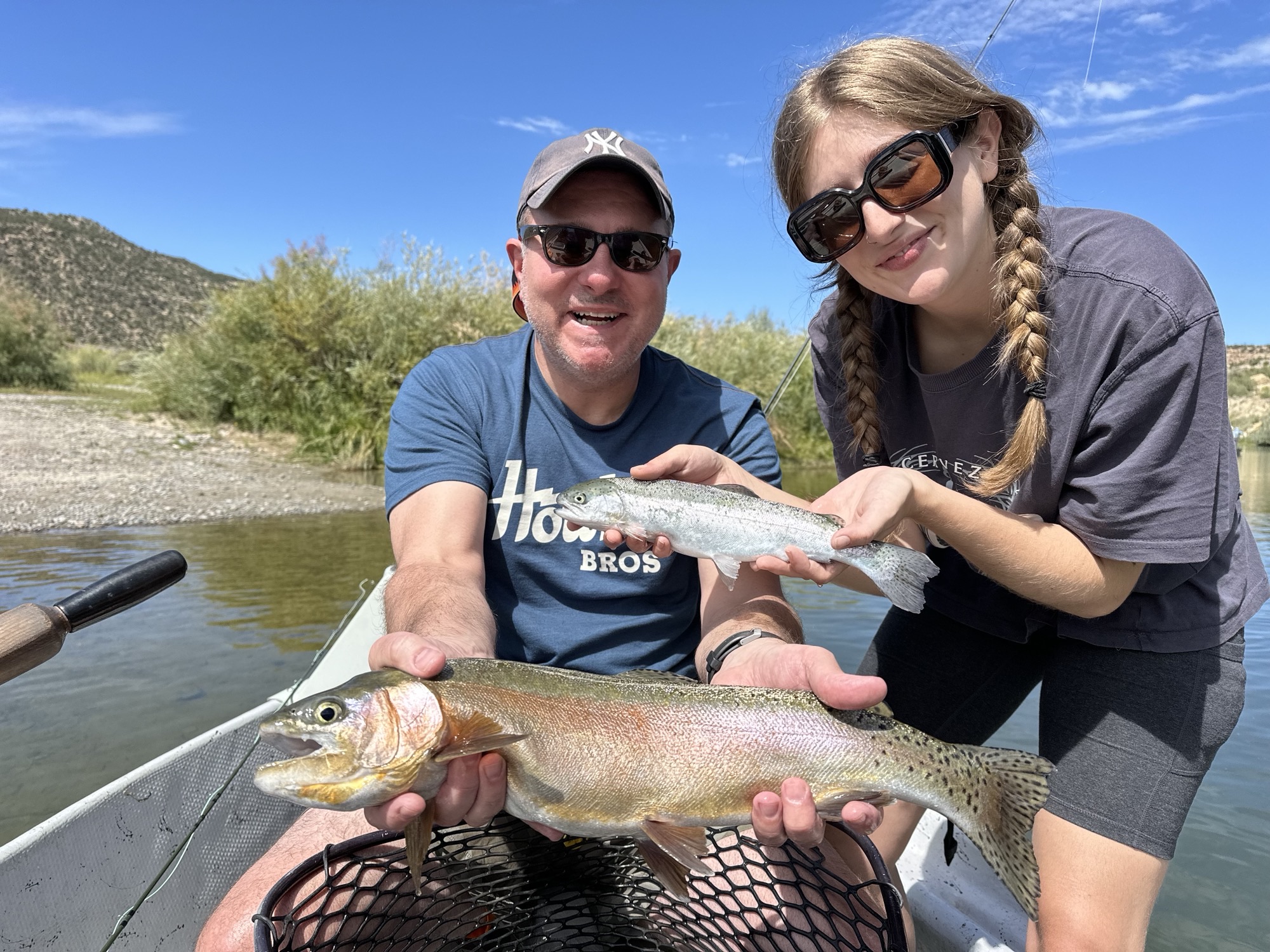 Client releasing large rainbow trout.