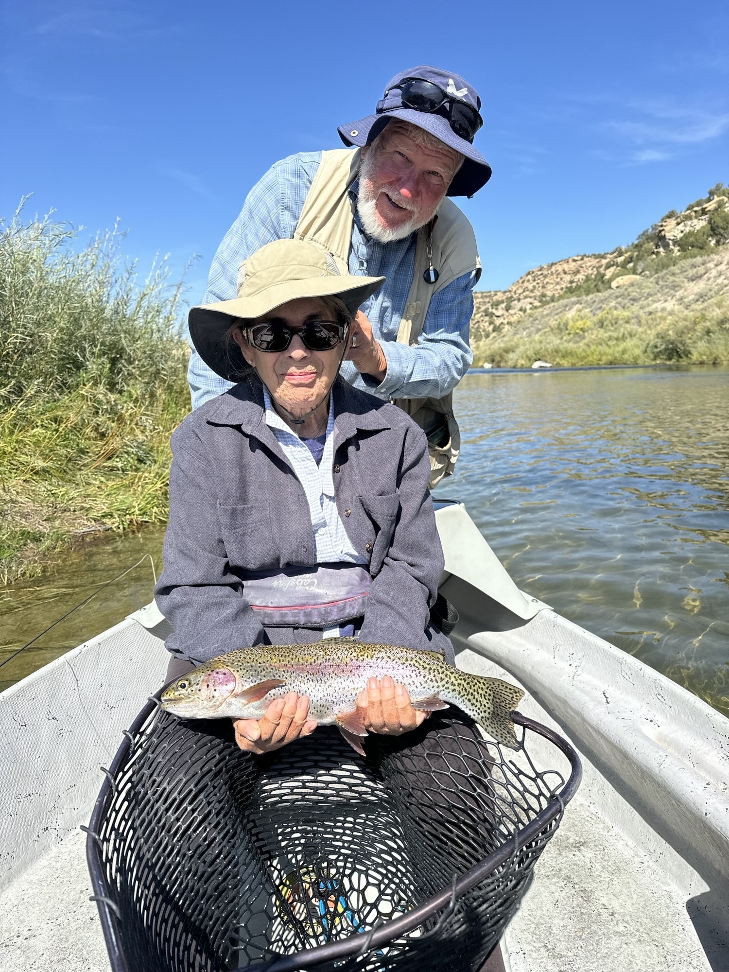 Client releasing large rainbow trout.