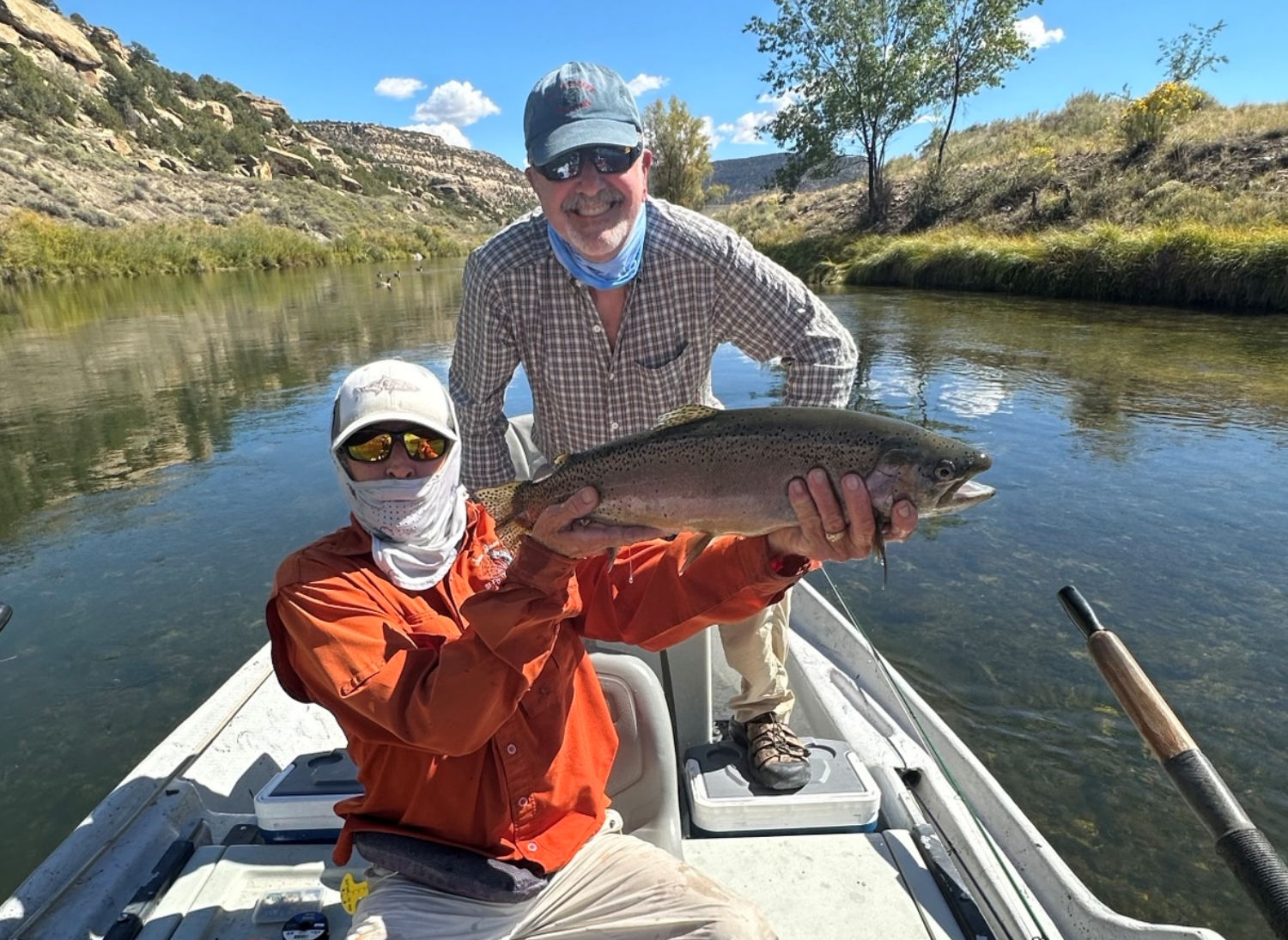 Client releasing large rainbow trout.