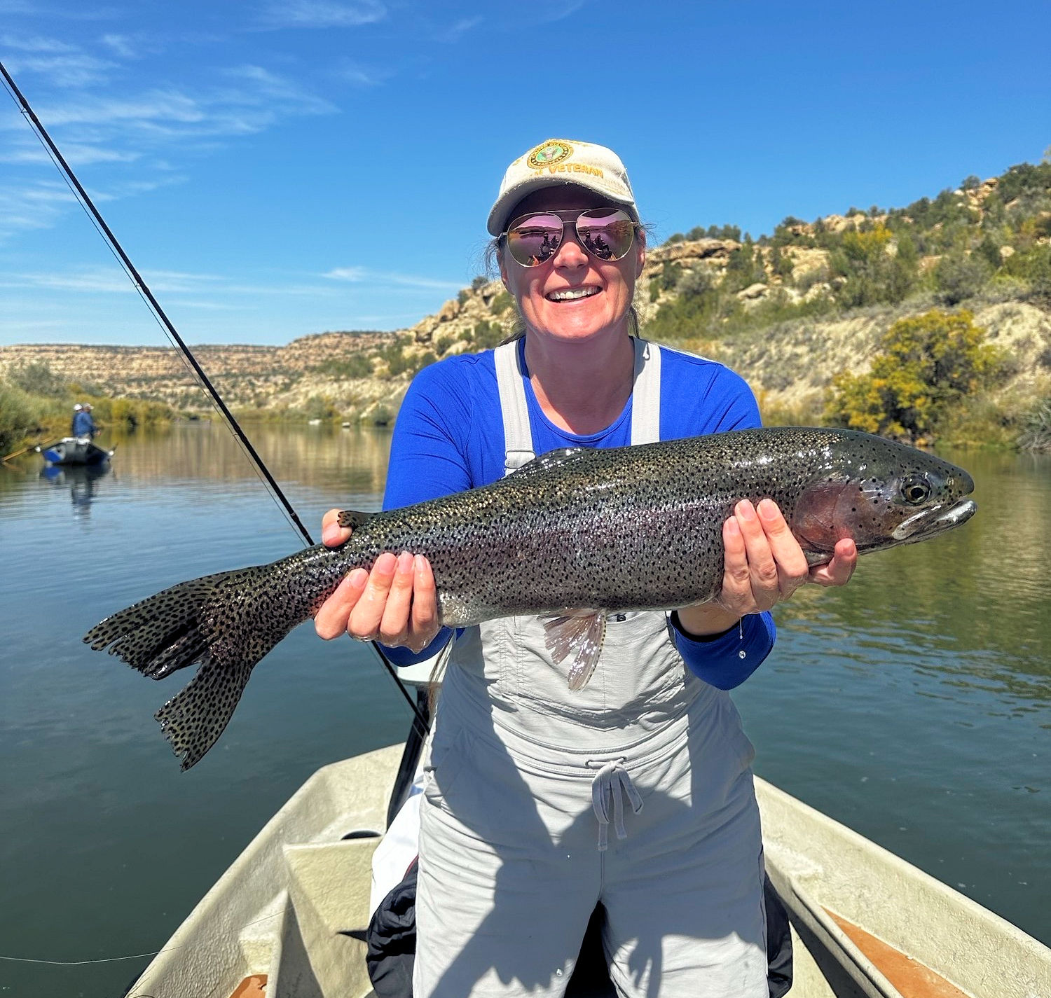 Client releasing large rainbow trout.