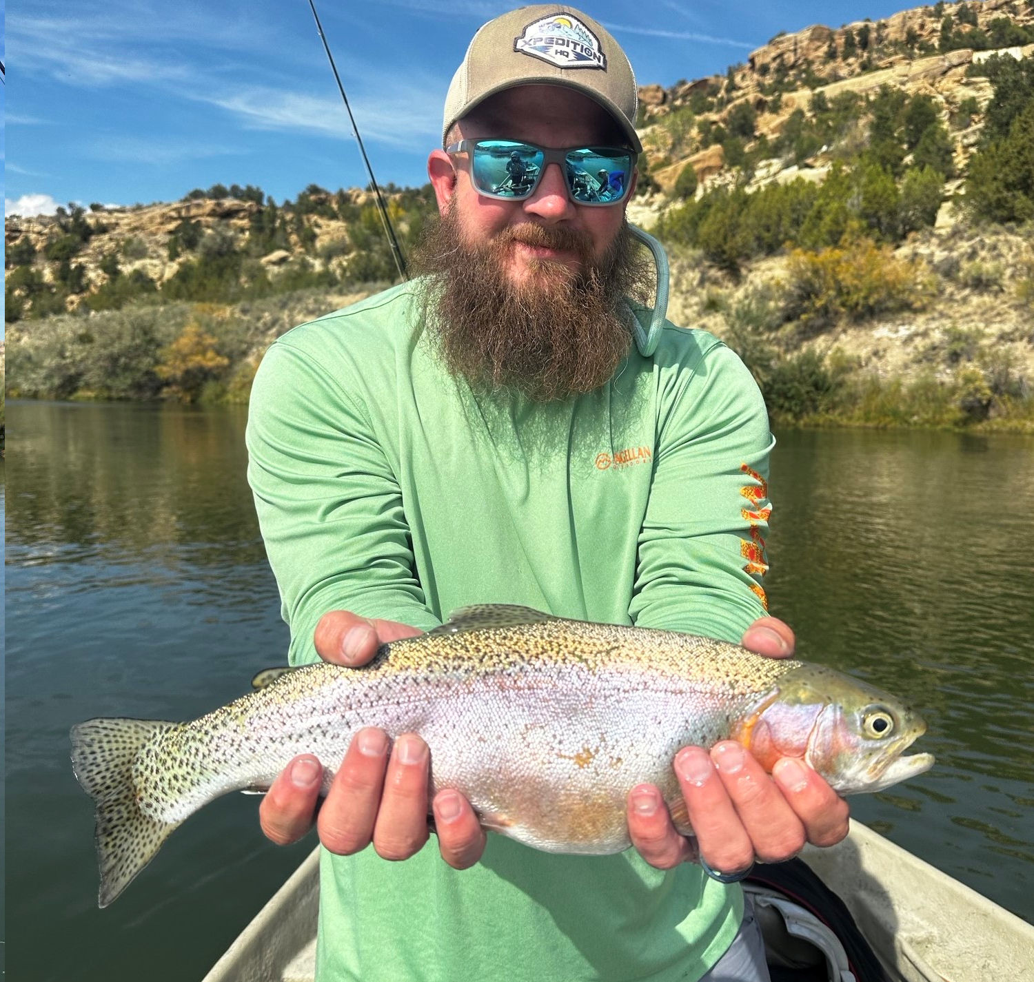 Client releasing large rainbow trout.
